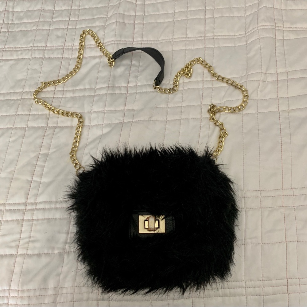 Black faux fur mini crossbody bag.